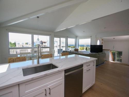 a kitchen with a sink and a counter top at Ocean-Views From Multiple Decks in Harvey Cedars