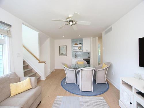 a living room with a table and chairs at Ocean-Views From Multiple Decks in Harvey Cedars