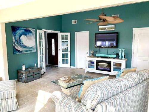 a living room with a couch and a flat screen tv at Rental Available For Your Vacation Pleasure, All The Comforts You Could Imagine, Great Location! in Manahawkin