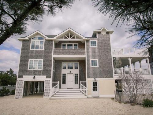 a large brick house with a white door at Large Ocean Side Home With Beautiful Views in Loveladies