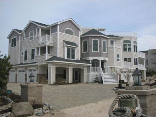 a large house with a large driveway in front of it at 1491 Smith in Loveladies