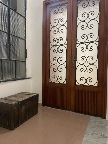 a wooden door with a wooden box next to it at da zia Emanuela in Ottaviano