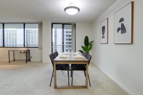 a dining room with a table and chairs and windows at Convenient Airport Proximity: Apt in Crystal City in Arlington