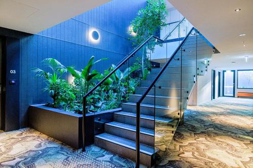 a staircase in a house with plants on the wall at Re’em Yarra Valley in Gruyere