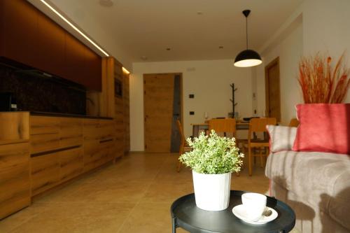 a living room with a couch and a table at Chalet Larix Andalo Deluxe Apartments in Andalo