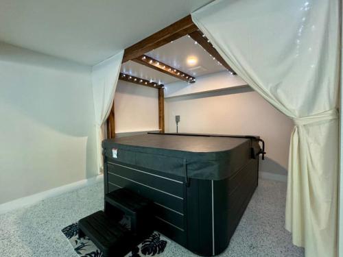 a room with a tent with a dresser in it at The Wildflower in Siesta Key