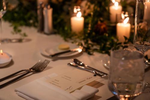 a table with a white table cloth with candles on it at The Ritz-Carlton, Rancho Mirage in Rancho Mirage