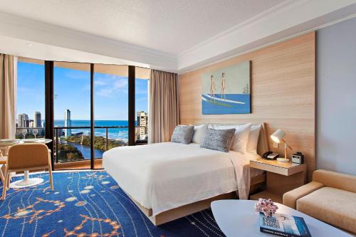 a hotel room with a bed and a large window at Marriott Vacation Club at Surfers Paradise in Gold Coast