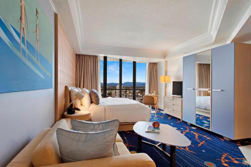 a hotel room with a bed and a couch at Marriott Vacation Club at Surfers Paradise in Gold Coast