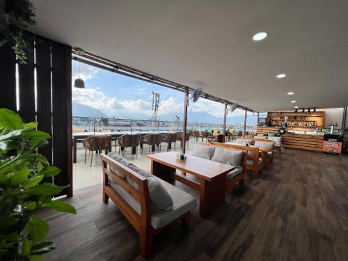 a restaurant with tables and chairs and a view of the ocean at Kathmandu Height Boutique Hotel in Kathmandu