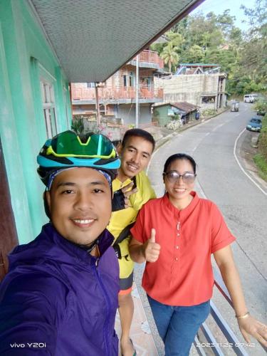 two men and a woman posing for a picture at BANAUE EVERGREEN HOSTEL AND RESTAURANT in Banaue