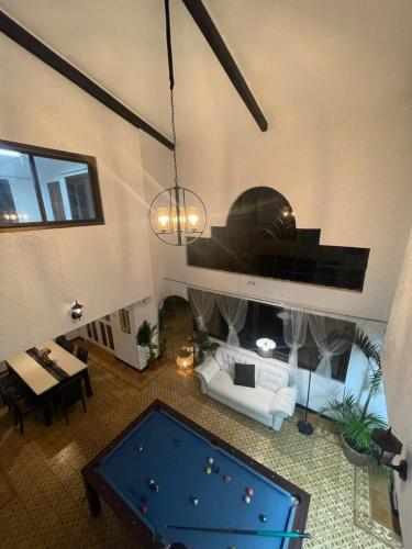 an overhead view of a living room with a pool table at Sky Rancho Hostel in Tagaytay