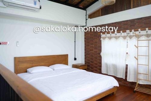 Postel nebo postele na pokoji v ubytování SakaLoka Cottage1- Mountain and Rice Field View