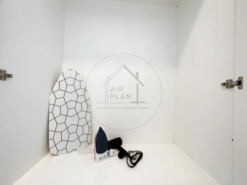 a white room with a mirror and a pair of shoes at PD 4 Bedrooms Duplex - Full Seaview (Up to 16 Pax) in Port Dickson