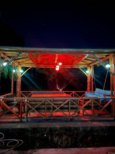 a pavilion with benches and lights at night at VILLA in Tekirdag- Istanbul in Tekirdag