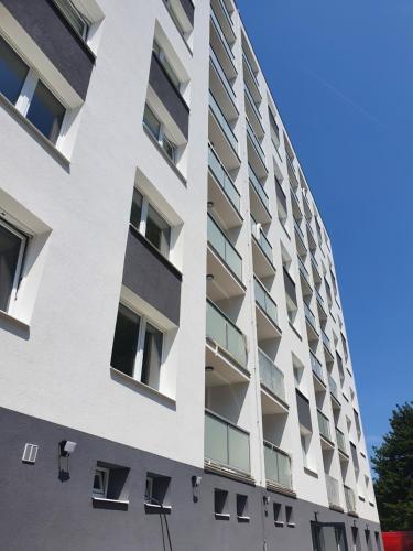 an apartment building with balconies on the side at Apartmány Česká Třebová in Česká Třebová