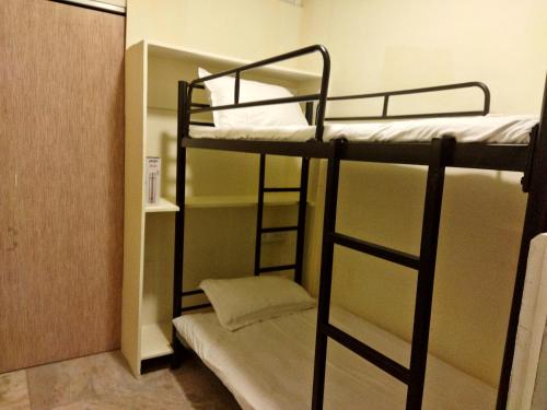a bunk bed room with two bunk beds in it at Near Airport AC Double Room at a Budget Inn in Mumbai