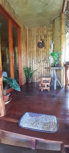 a room with a mattress on a wooden floor at Dumaguete Treehouse in Dumaguete