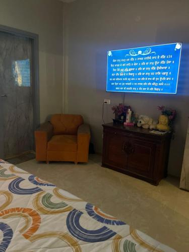 TV tai viihdekeskus majoituspaikassa 3 Bhk Homestay Apartment