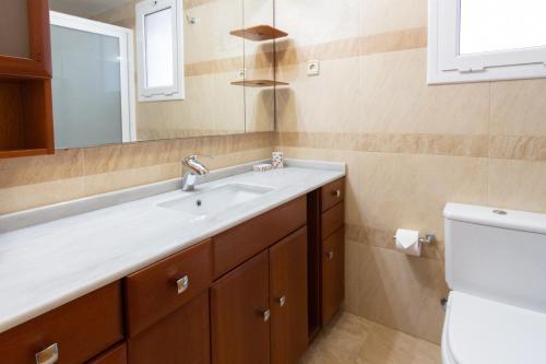 a bathroom with a sink and a toilet at Catalunya Casas Tranquil Paradise, Private Pool and only 200 meters to beach! in L'Ampolla