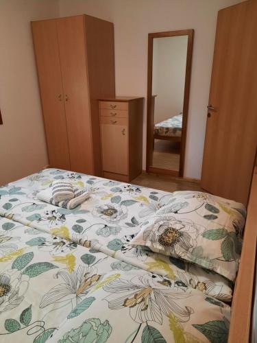 A bed or beds in a room at APARTMA SABOTIČ