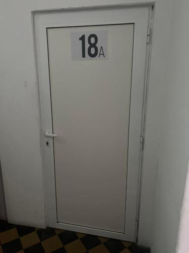 a white door with the number on it at Wohnung 18A in Lutherstadt Eisleben