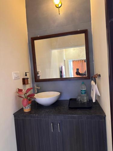 a bathroom with a sink and a mirror at Hidden beach stay in Chennai