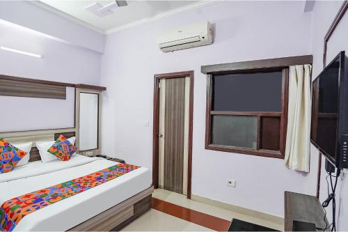 Una cama o camas en una habitación de Hotel Premium Golden Era