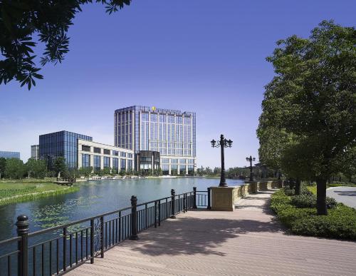 a view of a river with buildings in the background at InterContinental Changzhou by IHG in Changzhou