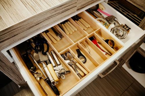 a drawer filled with lots of kitchen utensils at Big Garden House in Dunajská Streda