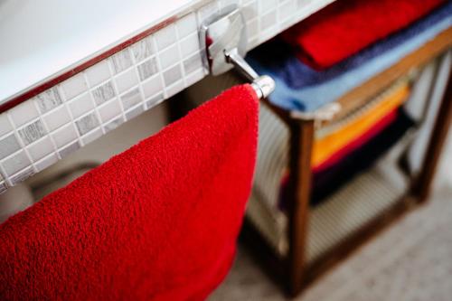 a bunk bed with a red towel hanging from it at Big Garden House in Dunajská Streda