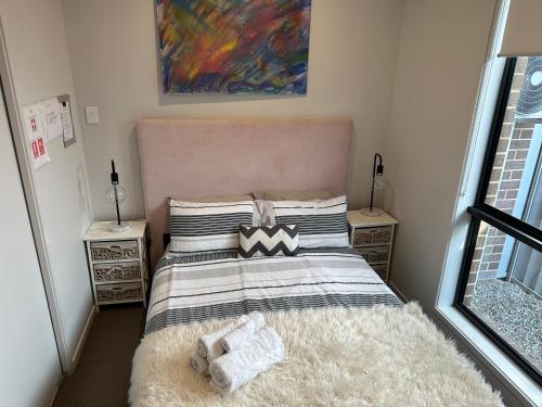 a bedroom with a bed and two night stands at Cool Air Austral with AC in Austral