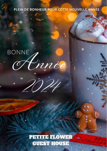 a christmas card with a cup of coffee at Petite Flower Guest House in Talata-maty