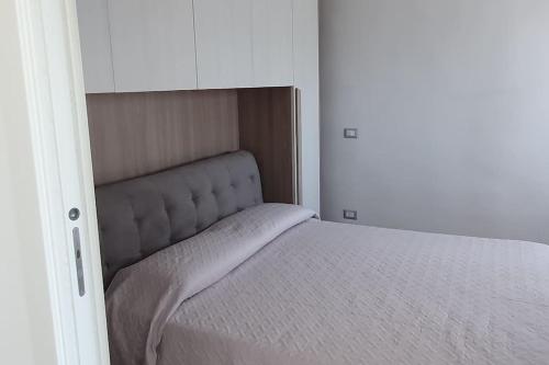 a small bedroom with a bed in a room at alloggio belvedere & relax in Macchia Valfortore