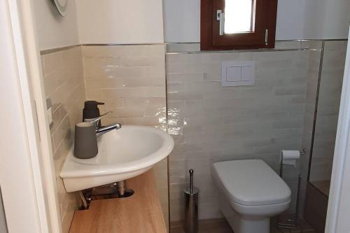 a bathroom with a sink and a toilet at alloggio belvedere & relax in Macchia Valfortore