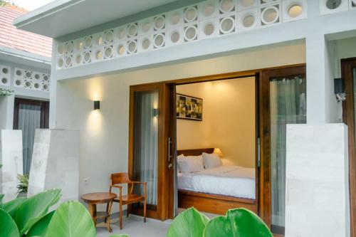 a bedroom in a villa with a bed at Sayana Bali Resto & Bar in Gianyar