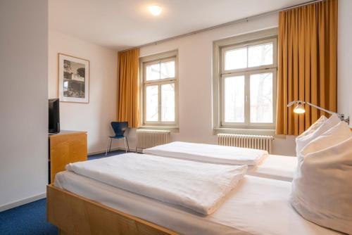 Postel nebo postele na pokoji v ubytování Alt-Weimar