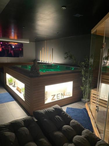 a living room with a pool table and a couch at Linfinity in Baillonville