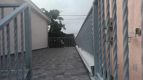 a balcony of a house with a gate at appartement in Charneca