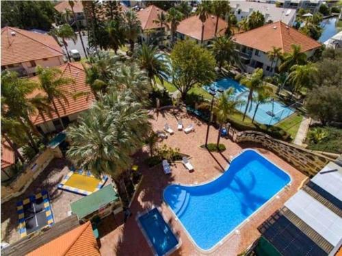 an overhead view of a swimming pool at a resort at Just Beachy Loft Villa in Mandurah