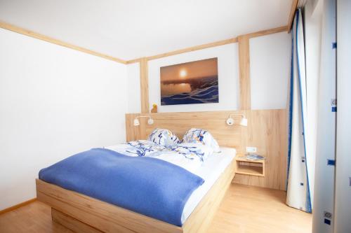 Postel nebo postele na pokoji v ubytování Gästehaus Seewinkel