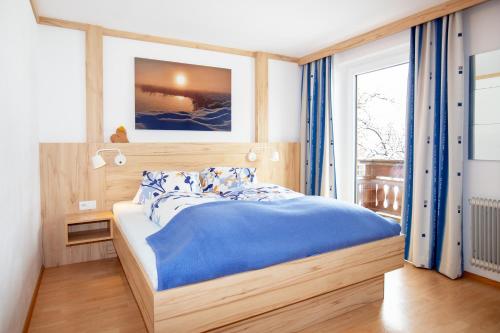 Postel nebo postele na pokoji v ubytování Gästehaus Seewinkel