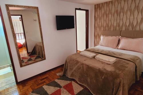 Katil atau katil-katil dalam bilik di Apartamento no Alto, o coração turístico de Teresópolis