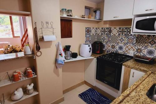 Dapur atau dapur kecil di Apartamento no Alto, o coração turístico de Teresópolis