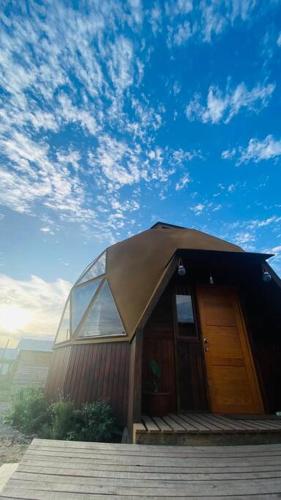 a small house with a dome roof on top at Domo Papudo in Papudo