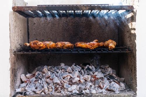 a group of food cooking in an oven at Dilpali Home Cum Farm stay in Sukhia Pokhari
