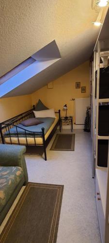a living room with two bunk beds and a couch at Pension Kalbach by Marion in Mittelkalbach