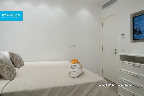 Krevet ili kreveti u jedinici u okviru objekta Luxury Apartmento Kiki con spettacolare vista mare R23117