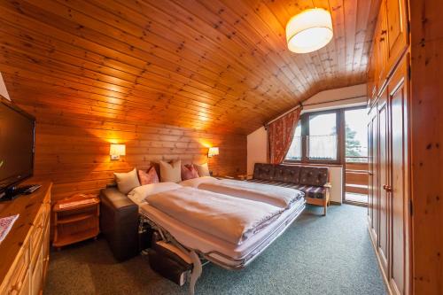 מיטה או מיטות בחדר ב-Dependance Villa Calluna