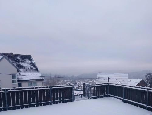 a snow covered roof of a house with a view at HAUS BRAILEN in Brilon Alme in Brilon